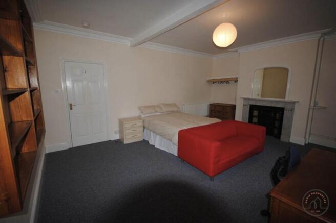 A spacious and well-maintained living room with...