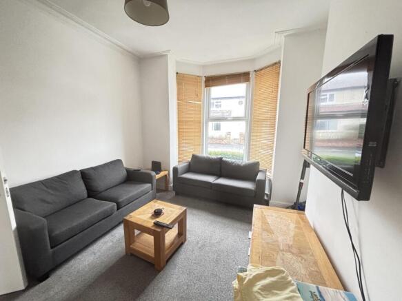 Bright, modern living room with two comfortable...