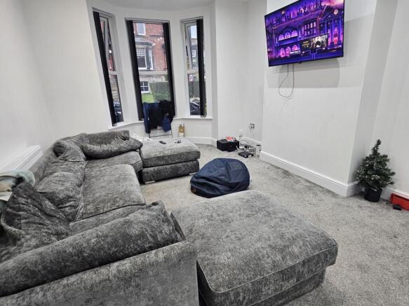 A modern and spacious living room featuring a l...