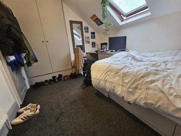 A spacious and well-maintained master bedroom f...