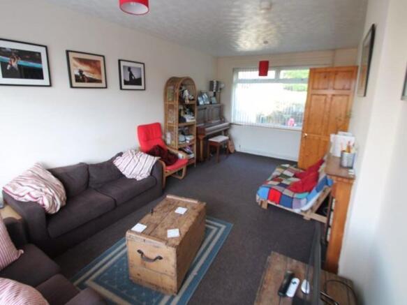 A cozy living room featuring a comfortable sofa...