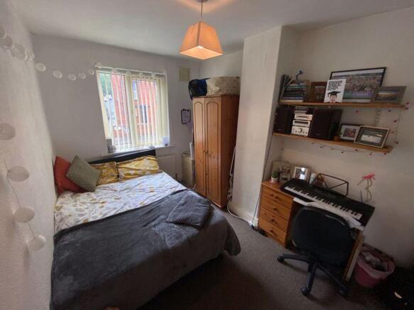 A cozy double bedroom featuring a comfortable d...