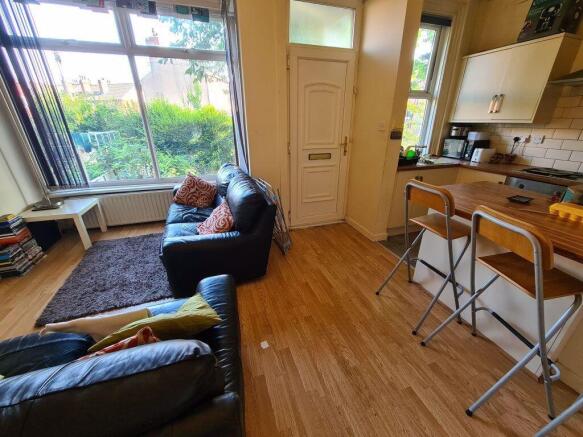 Bright and inviting living room featuring large...