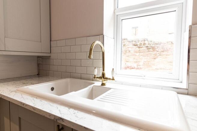 Bright and modern bathroom featuring a white ti...