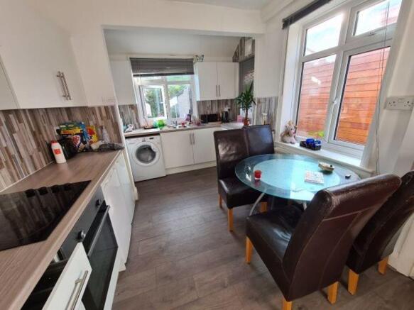 A bright and welcoming living room featuring am...