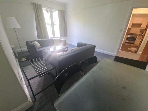 Bright and welcoming living room featuring comf...