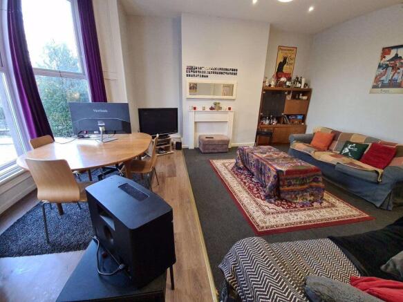 A spacious and inviting living room featuring c...