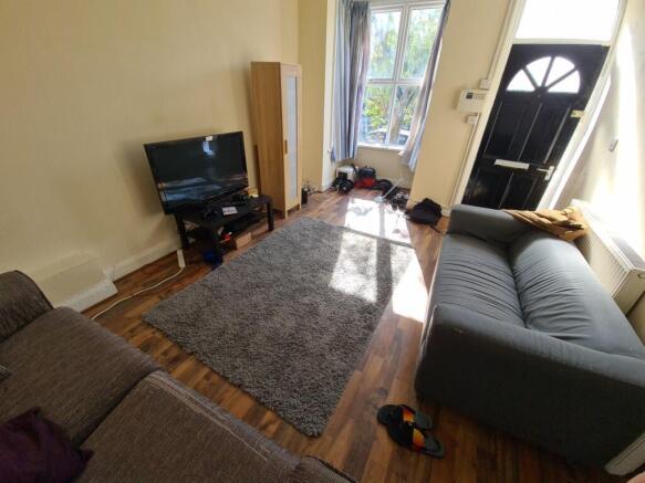 A well-lit, inviting living room featuring two ...