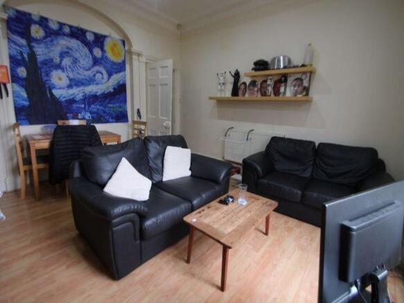 A cozy and inviting living room featuring two b...