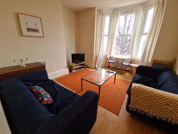 A welcoming living room featuring two comfortab...