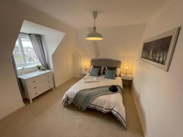 A spacious and bright large double bedroom feat...