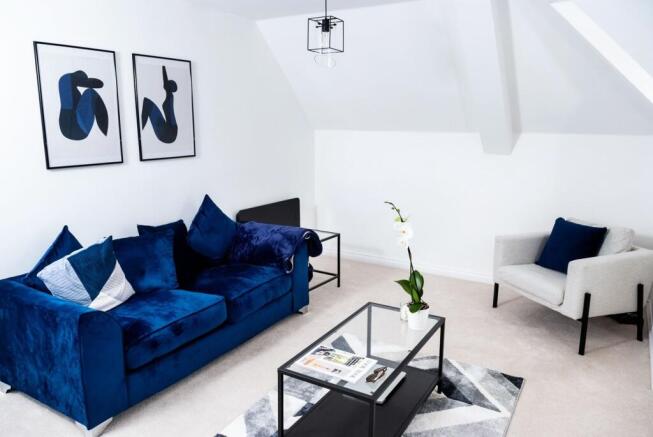 A spacious and stylish living room with modern ...