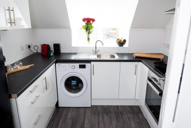 A modern and bright kitchen with ample natural ...