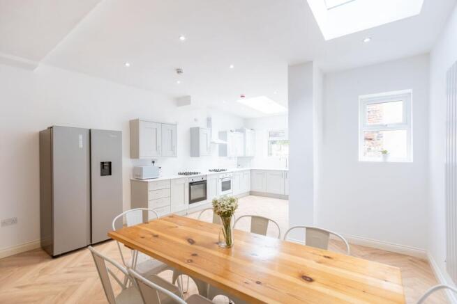 Bright and modern kitchen with ample natural li...