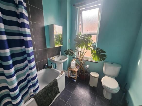 A bright and well-maintained bathroom suite fea...