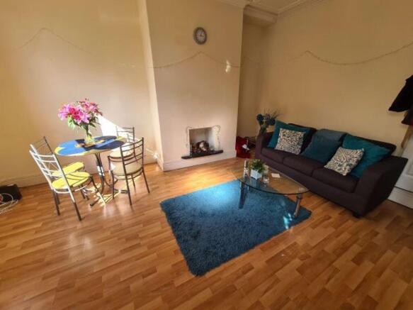 A bright and welcoming living room featuring a ...