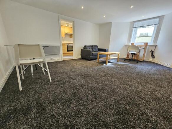 Bright and inviting living room featuring a lar...