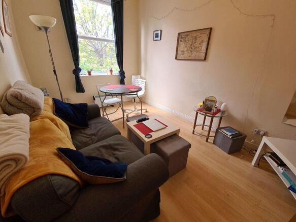 Cozy living room with a comfortable sofa, natur...