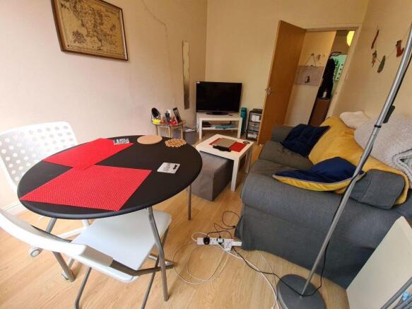 Cozy living space featuring a comfortable sofa ...