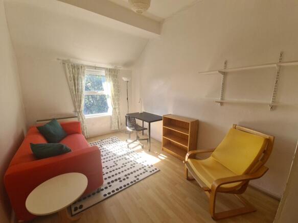 Bright and inviting living room featuring a com...