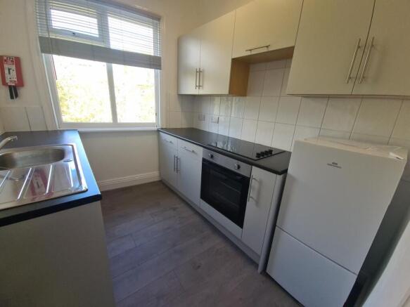 A bright and functional kitchen featuring moder...