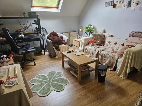 A cozy and inviting living room featuring comfo...