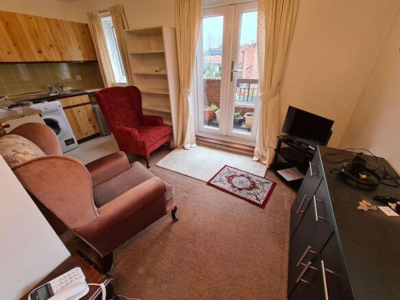 A cozy living room with comfortable armchairs a...