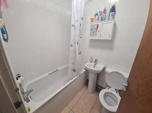 Bright and clean bathroom featuring a full-size...
