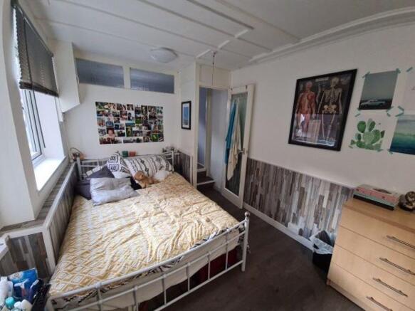 Bright and cozy double bedroom featuring a comf...