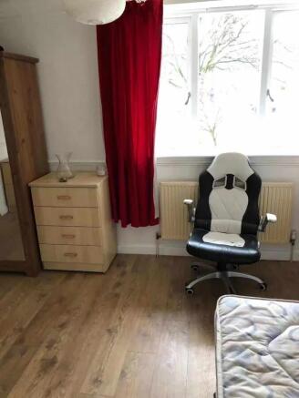 A neat single bedroom with natural light coming...