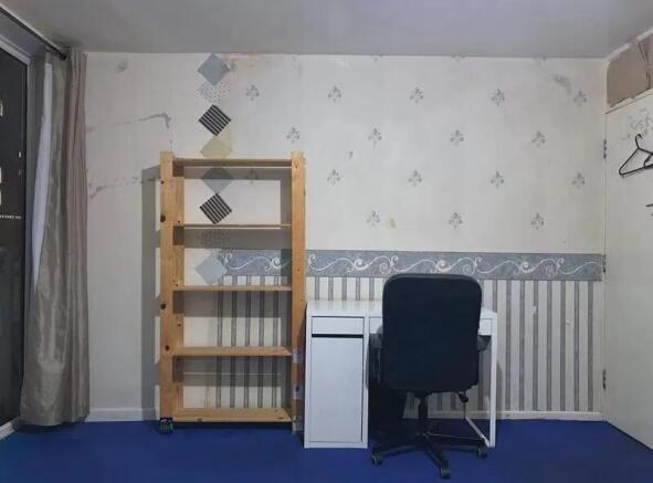 A simple communal workspace featuring a wooden ...