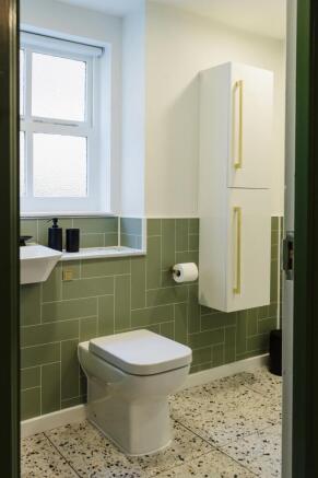 Bright and clean bathroom featuring a modern to...