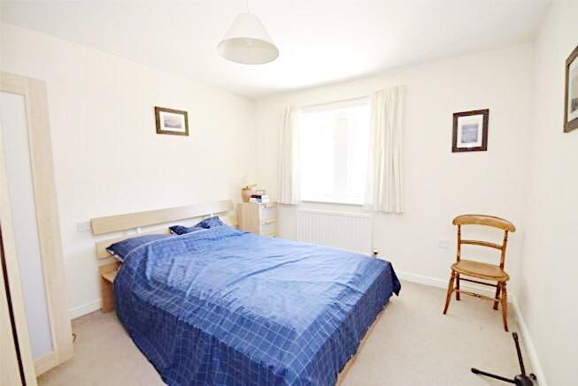 Bright, neatly presented bedroom with a double ...