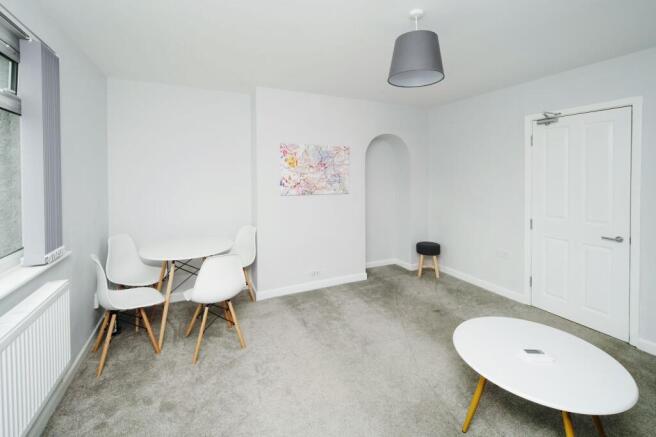 Bright, freshly decorated living room with neut...