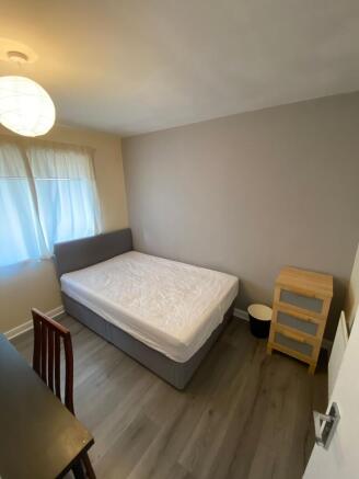 Bright and inviting double bedroom featuring a ...