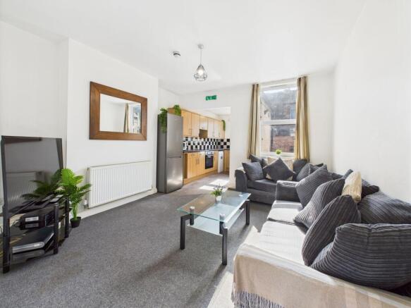 A bright and spacious living room with a large ...