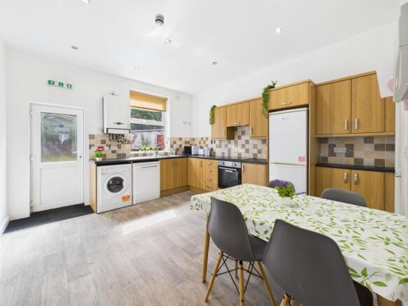 Bright and modern kitchen with ample natural li...