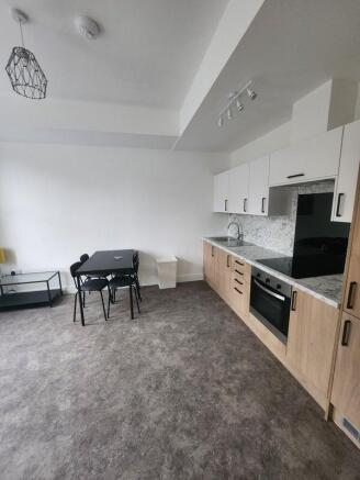 Modern and well-maintained kitchen area with sl...