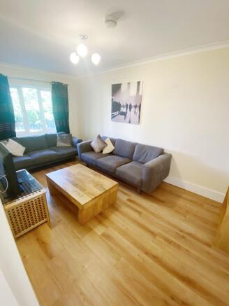 Bright, modern living room with two comfortable...