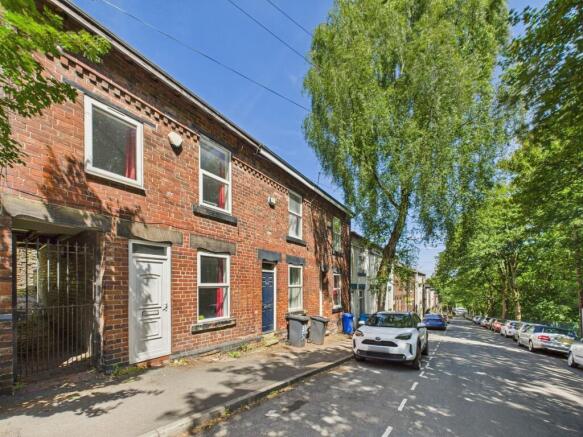 A charming exterior view of a traditional brick...