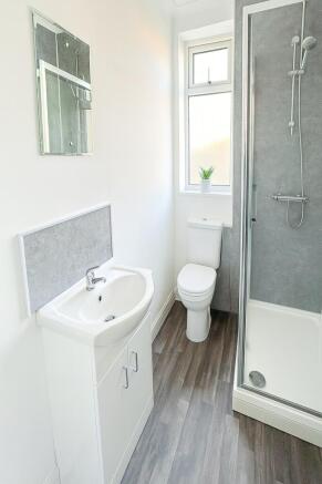 Bright and clean bathroom featuring a modern sh...