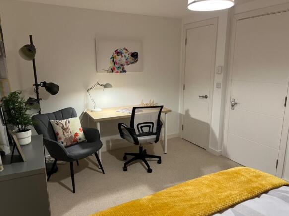A stylish and inviting double bedroom featuring...