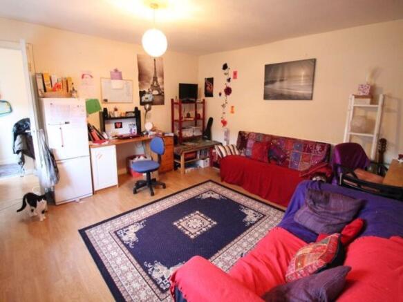 A cozy and well-maintained living room featurin...