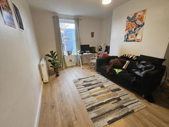 A bright and inviting living room featuring a c...