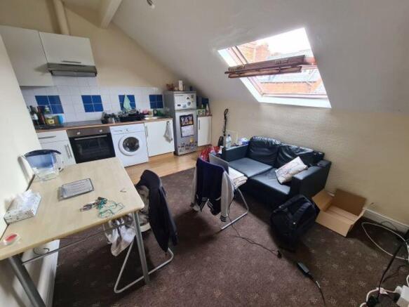 A functional kitchen area with a washing machin...