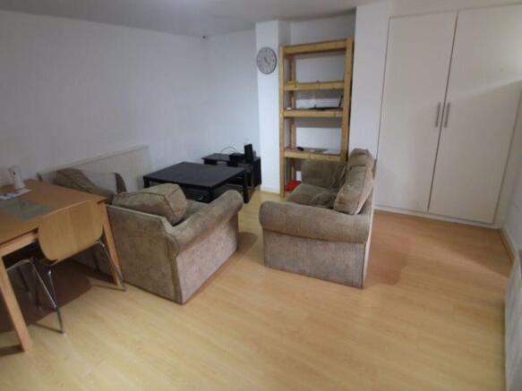 A bright and inviting living room with comforta...