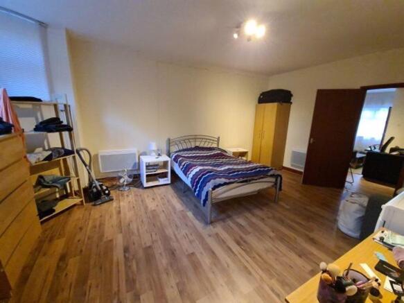 A spacious and well-maintained living room with...