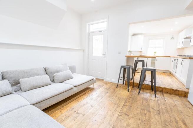 Bright and airy living space featuring a comfor...