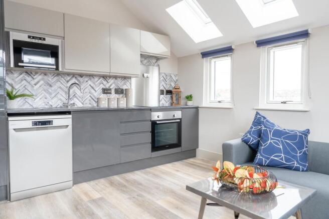 Bright and modern kitchen with ample natural li...