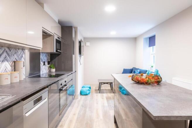 Modern and bright kitchen with sleek cabinetry,...